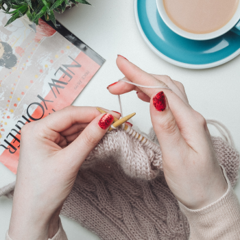 Olive drab green insulated bottle with flared screw lid and flat top.